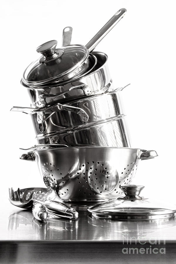 Stack with stainless steel pots and pans on white Photograph by Sandra  Cunningham - Fine Art America