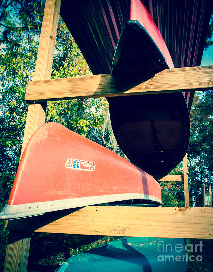 Boat Photograph - Stacked Caddo Canoes by Sonja Quintero