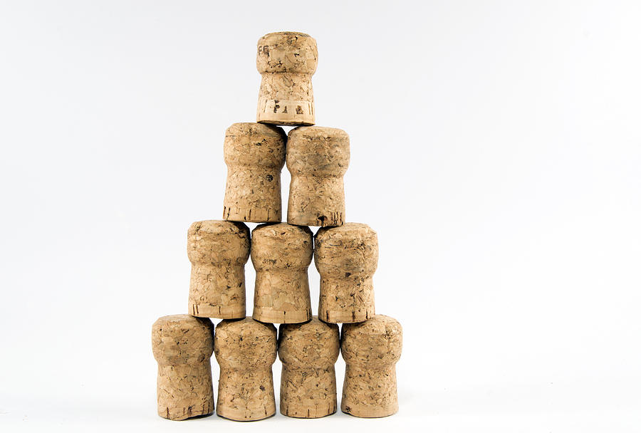 Stacked champagne corks Photograph by Luis Diaz Devesa