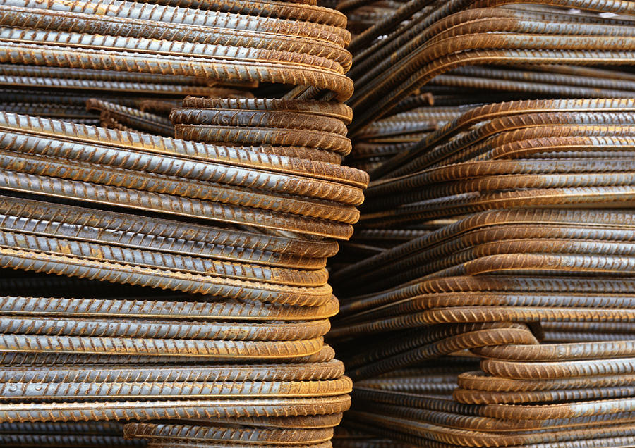 Stacks of metal rods, close-up Photograph by James Hardy