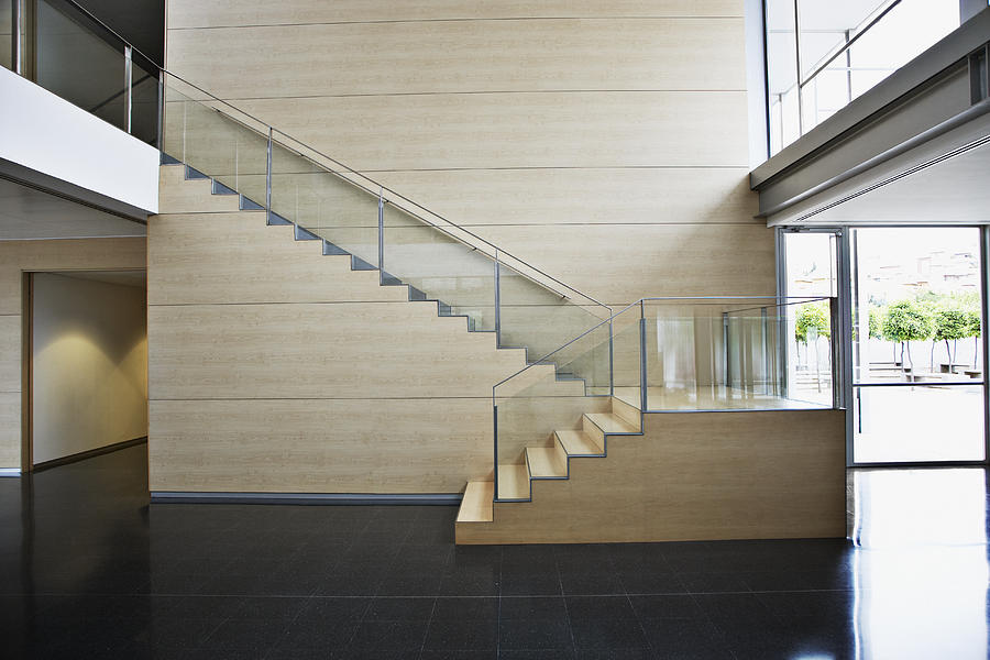 Staircase in modern office building Photograph by Tom Merton
