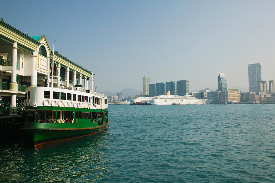 Architecture Photograph - Star Ferry On A Pier With Buildings by Panoramic Images