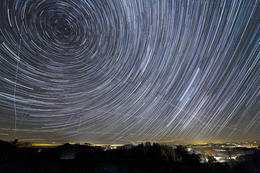 Star trails and aeroplane trails Photograph by Science Photo Library ...