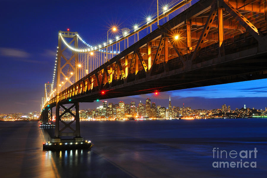 San Francisco Skyline Framed by Bay Bridge at Dusk Photograph by Tom Schwabel