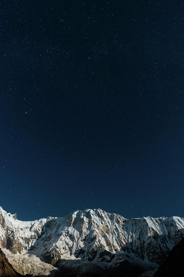 Stars Shining In Night Sky Above Snowy Photograph by Fotovoyager