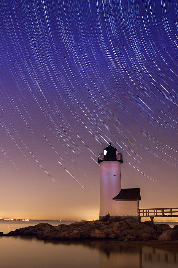 Stars trailing over Lighthouse Photograph by Jeff Folger