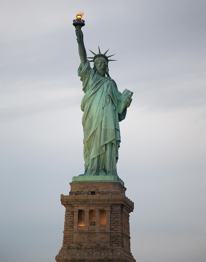 Statue of Liberty at sunset Photograph by Jack Nevitt