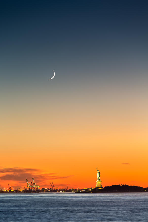 Statue of Liberty under a crescent moon Photograph by Mihai Andritoiu