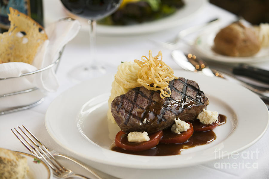 Steak Dinner On White Plate. Photograph