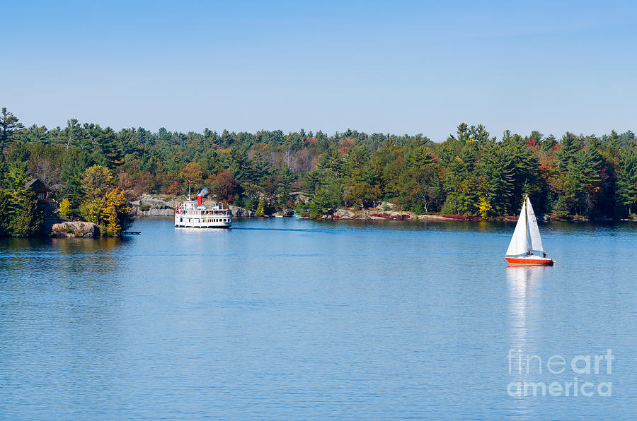 Steamboat Cruiser And Sailboat On Blue Lake Photograph