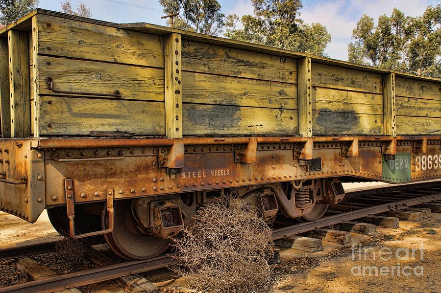 Steel Wheels And Tumbleweed Photograph by Peggy Hughes