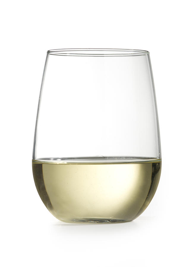 Stemless Wine Glass With Chardonnay Isolated On White Photograph by Sarasang