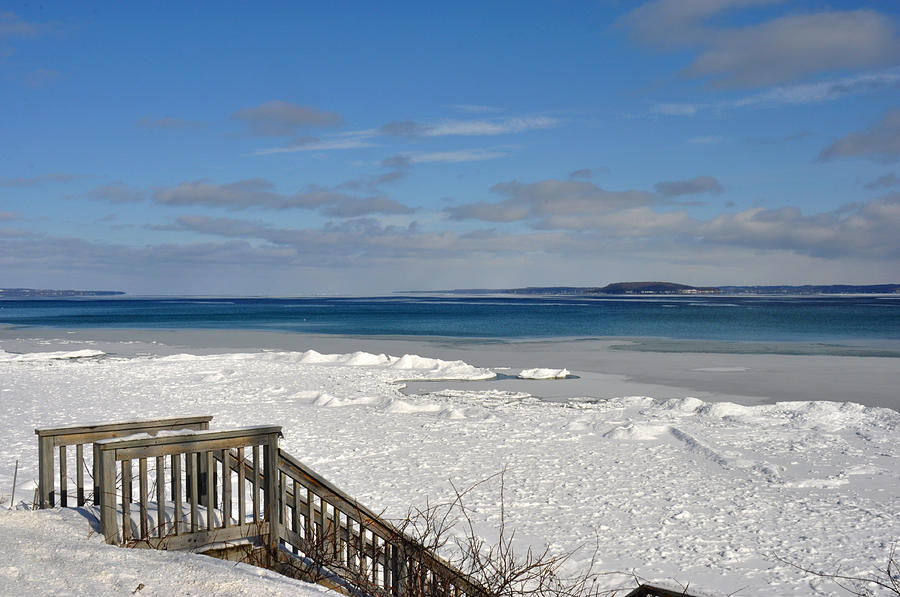 Steps to a snowy beach by Grand Traverse Bay Photograph by Diane Lent