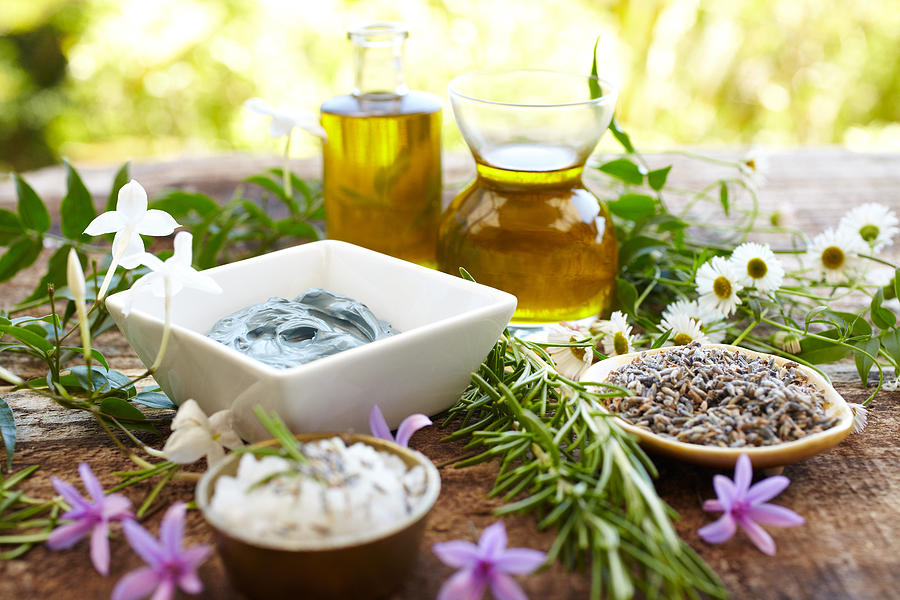 Still life of herbs, massage oil, mud mask, rosemary, salt Photograph by GSPictures