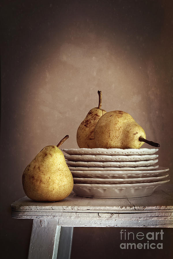 Still life of pears on plates Photograph by Sandra Cunningham