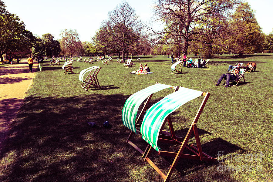 Still some vacant deck chairs in Hyde Park London during early s Photograph by Peter Noyce