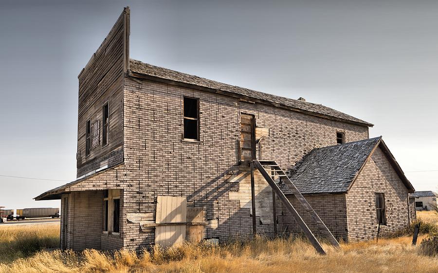 Abandoned, old building on Central Avenue, Moccasin, Montana, USA. #1 Photograph by Mick Flynn