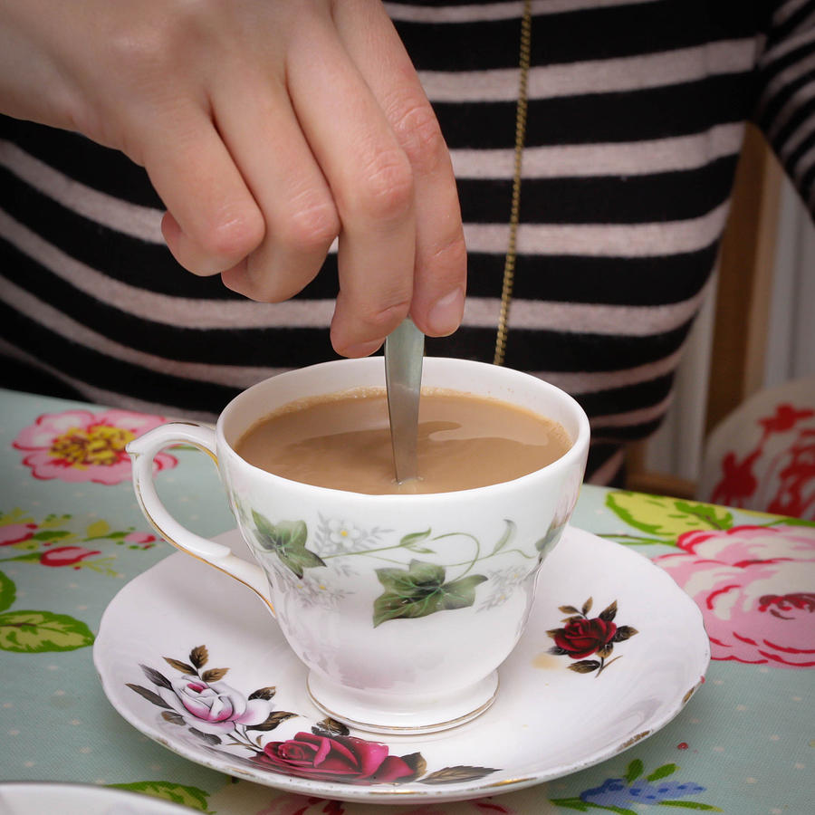 Tea Photograph - Stirring tea  by Tom Gowanlock