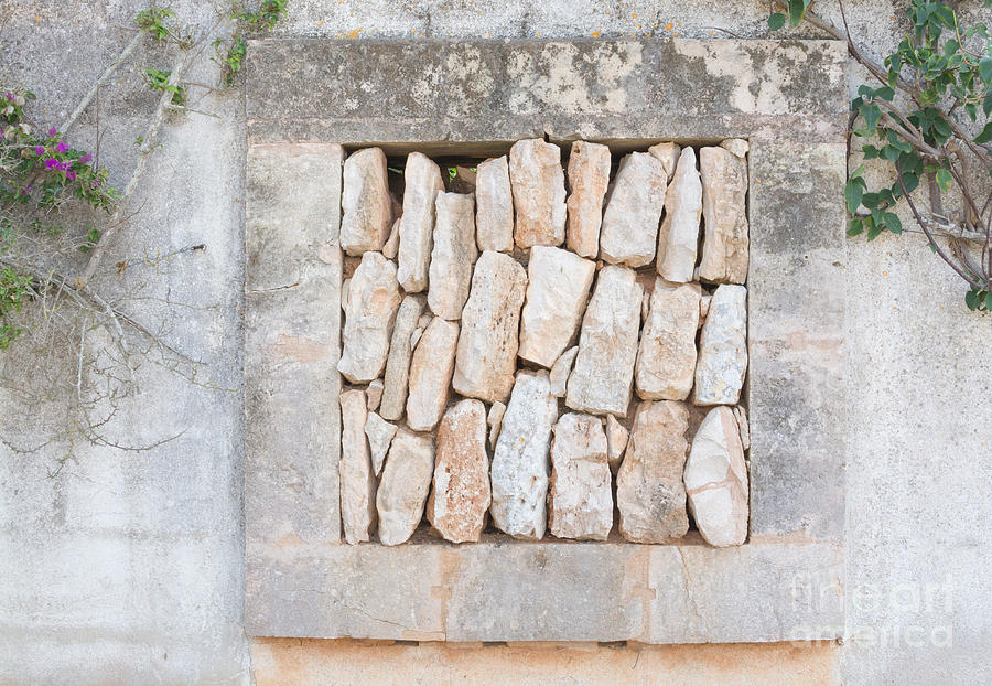 Architecture Photograph - Stone wall opening with stack of rocks by Ingela Christina Rahm