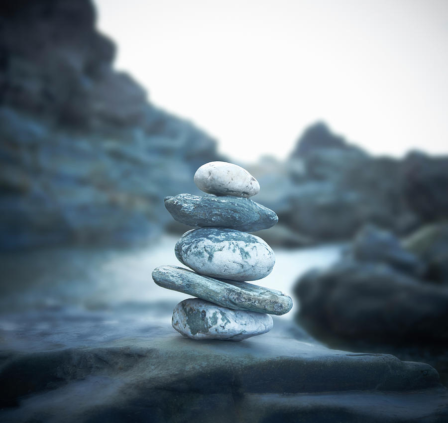 Stones Stacked Up On Rocky Coastline Photograph by Dougal Waters
