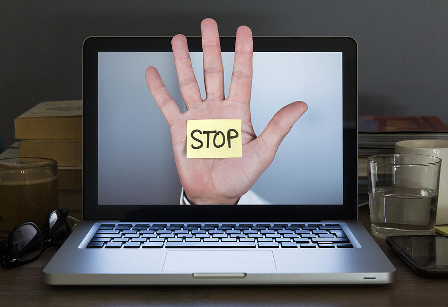 Stop hand appearing out of Laptop computer screen Photograph by Dimitri Otis