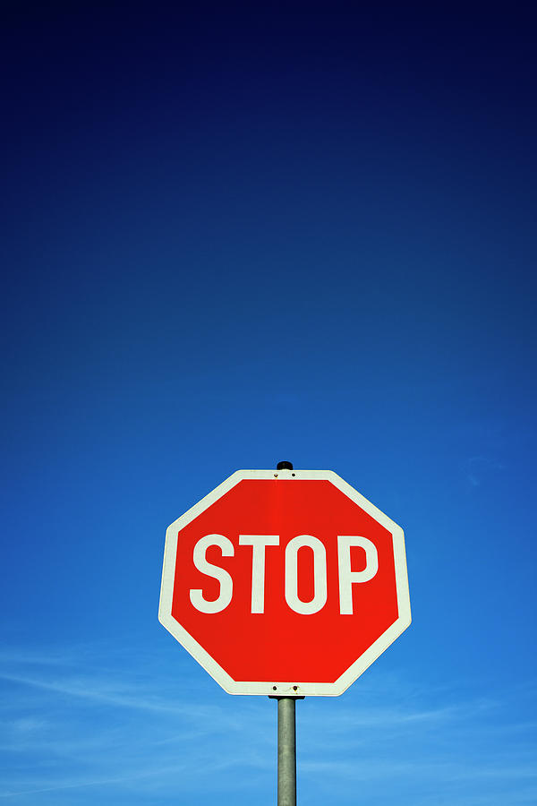 Stop Sign And Blue Sky Photograph by Thomas Winz