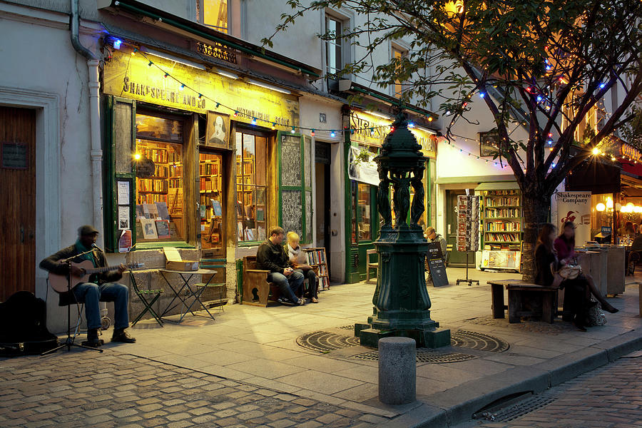 Architecture Photograph - Store At Dusk, Paris, Ile-de-france by Panoramic Images