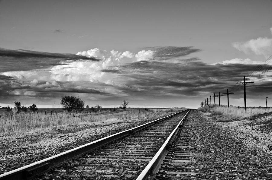 Storm Cloud above Rail Road Tracks Photograph by Eric Benjamin