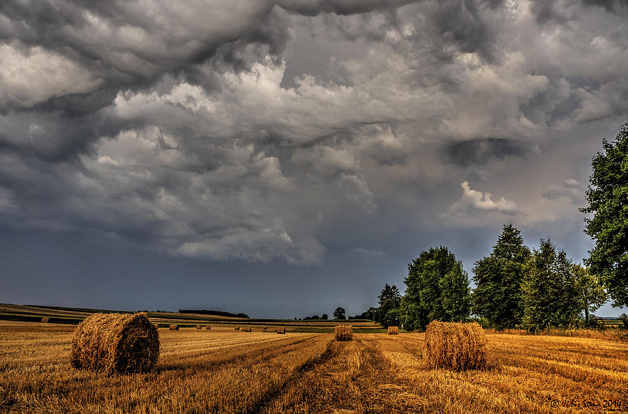 Landscape Photograph - Storm Clouds over Harvested Field in Poland 2 by Julis Simo