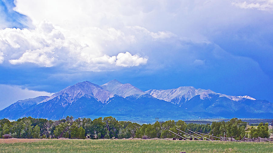 Storm Clouds over Snow-covered Mountain Peaks in Colorado Photograph by Ruth Hager