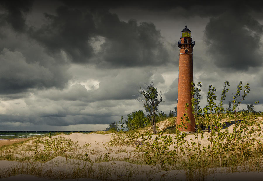 Storm Clouds passing the Little Sable Point Lighthouse Photograph by Randall Nyhof
