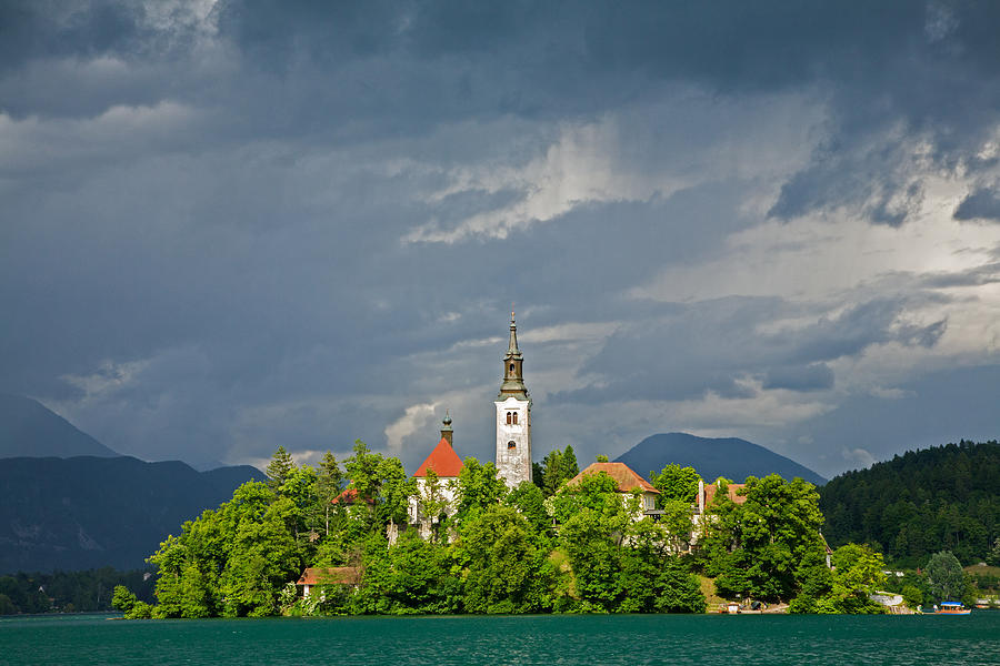 Storm light over Lake Bled Photograph by Ian Middleton