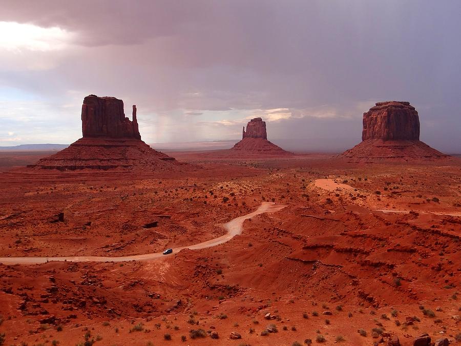 Storms moving through Monument Valley Photograph by Keith Stokes