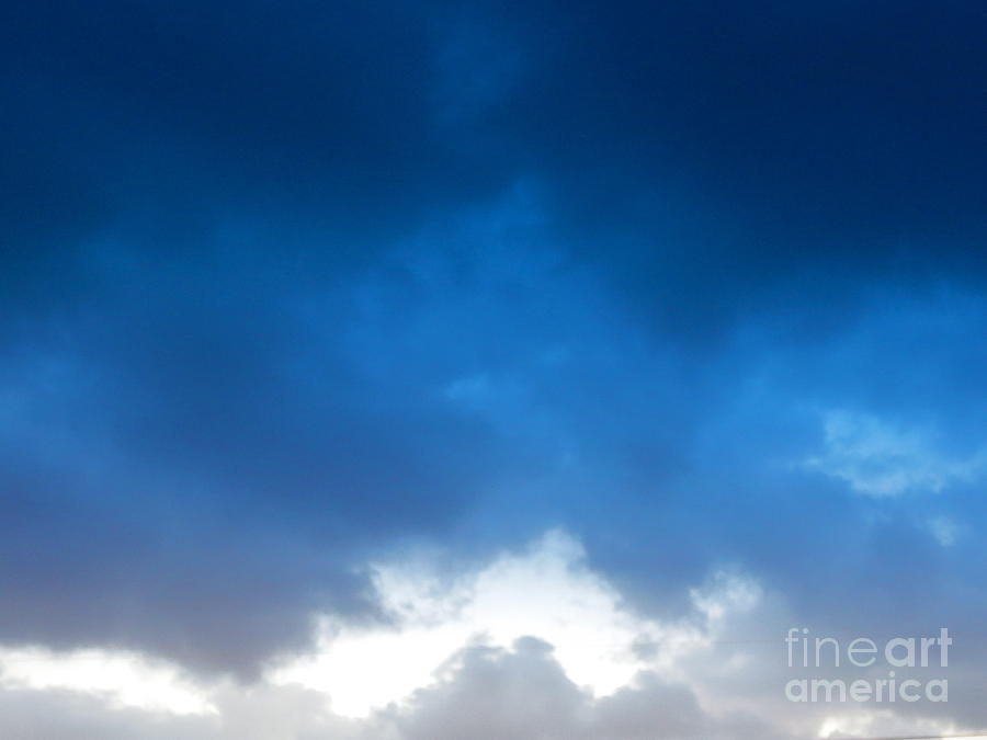 Stormy Clouds of Blue. Photograph by Robert Birkenes