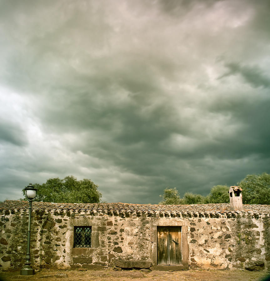 Stormy Clouds Over Ancient Building Photograph by Dirk Ercken