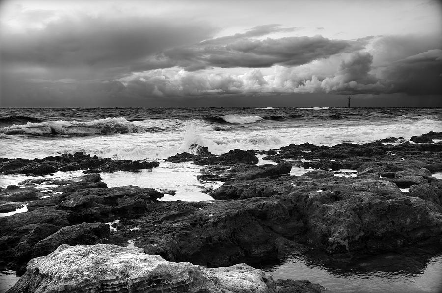 A black and white landscape of a wild sea painting of black the rocks of Menorca north shore Photograph by Pedro Cardona Llambias