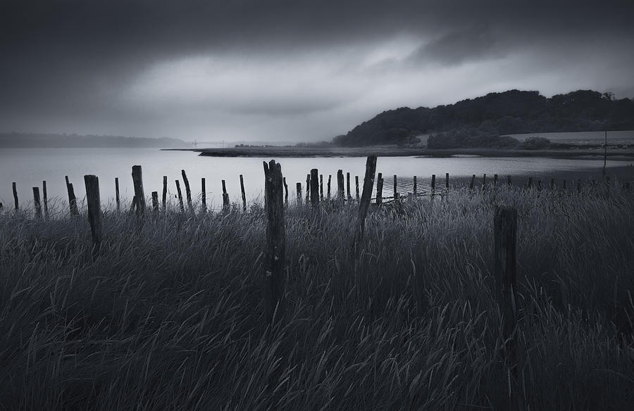 Stormy weather over an Estuary in Brittany, France Photograph by Kristian Bell