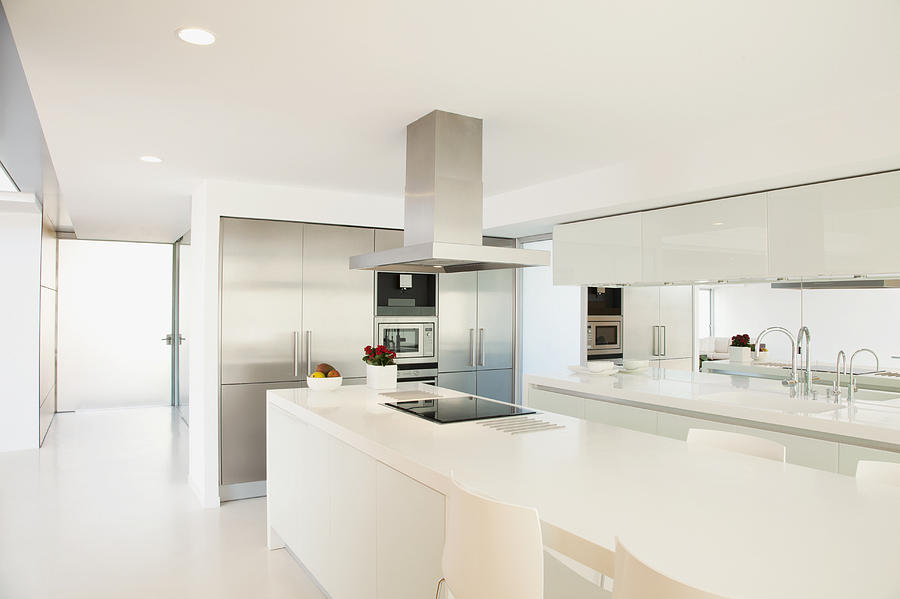 Stove and counters in modern kitchen Photograph by Martin Barraud