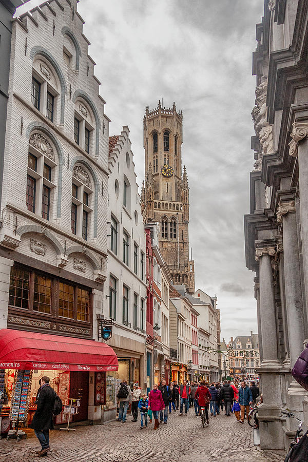Straat in Brugge, België met uitijk op de kerktoren in het centrum Photograph by Kjschraa
