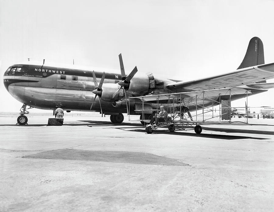 Stratocruiser And Biplane Photograph by Underwood Archives