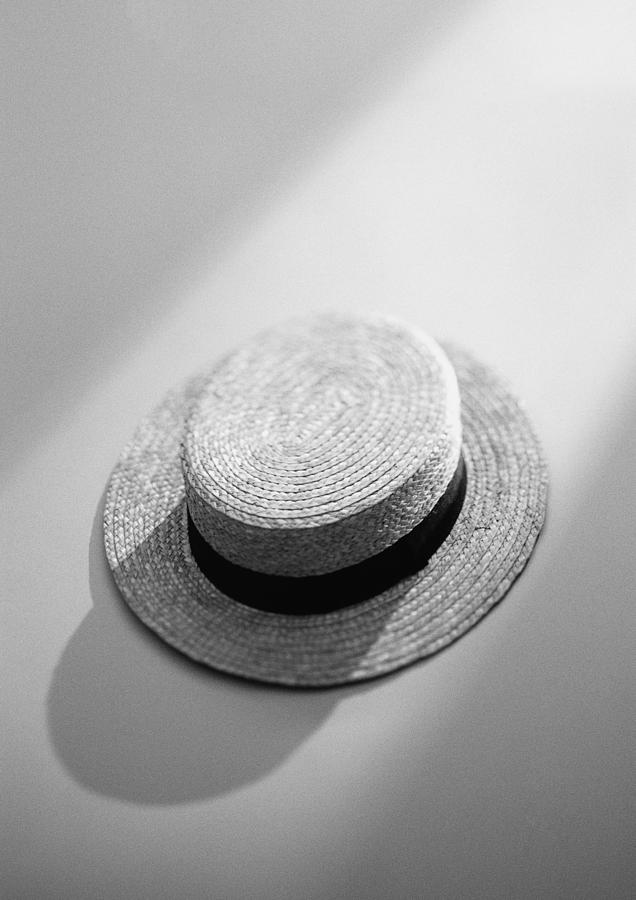 Straw hat, elevated view, b&w. Photograph by Frederic Cirou