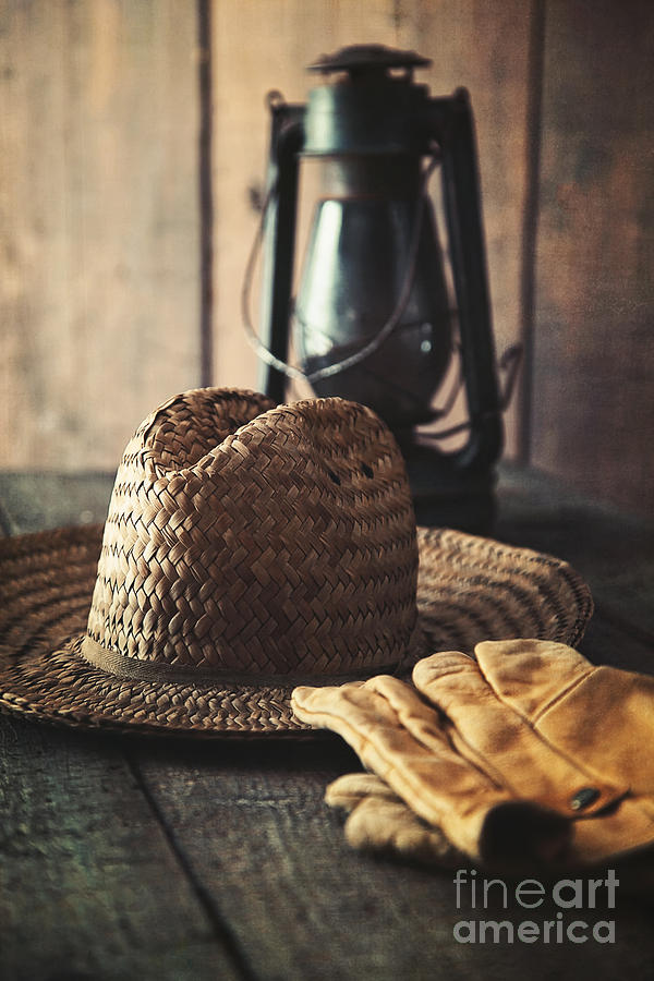 Straw hat gloves and lantern on table Photograph by Sandra Cunningham