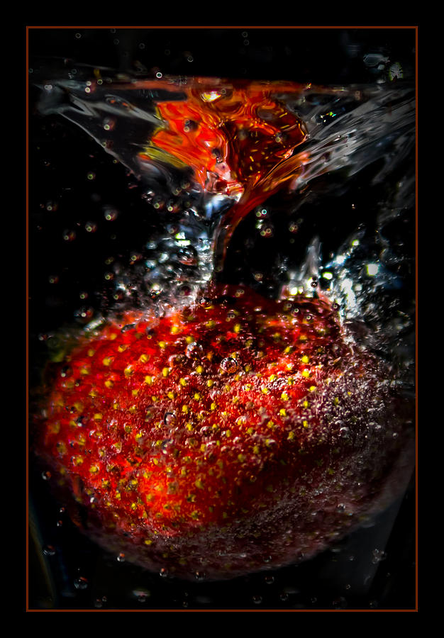 Strawberry Dunk Photograph by Ernest Echols