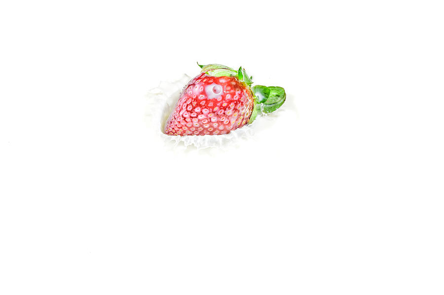 Strawberry in Milk Photograph by Peter Lakomy