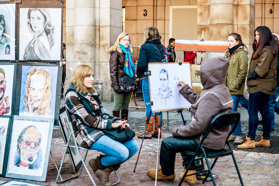 Street Artist drawing portrait, Plaza Mayor, Madrid Photograph by Anouchka