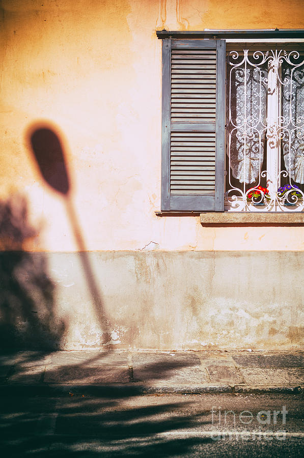 Street lamp shadow and window Photograph by Silvia Ganora