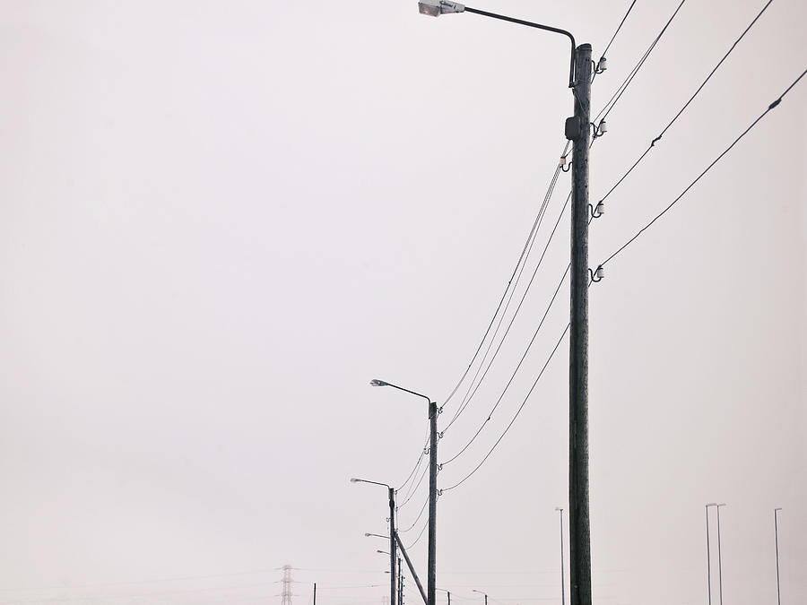 Street Lights In Snowy Landscape Photograph by Kmm Productions
