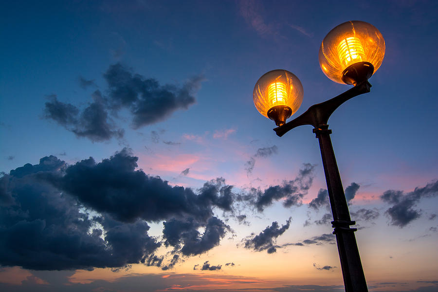 Streetlamp And Cloudy Nightsky Photograph by Andreas Berthold