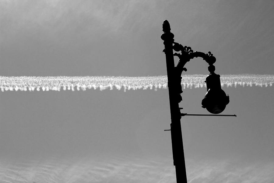 Streetlamp and Vapor Trail Horizontal BW Photograph by Mary Bedy