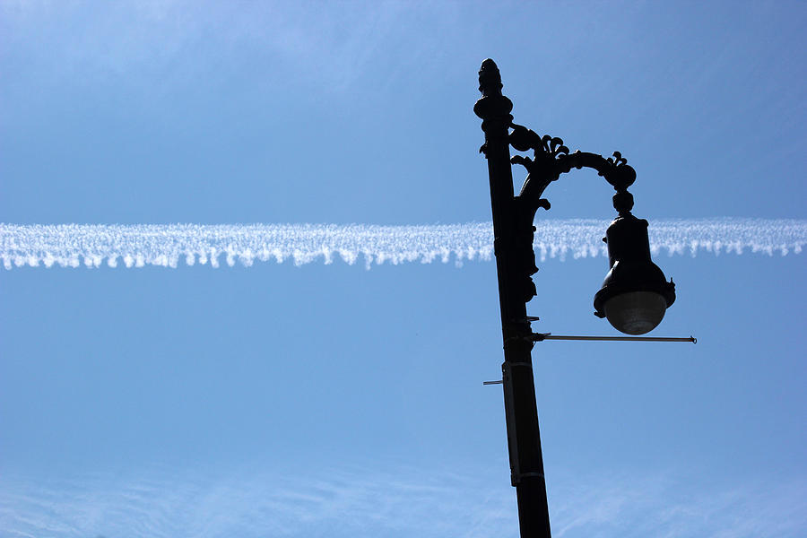 Streetlamp and Vapor Trail Horizontal Photograph by Mary Bedy